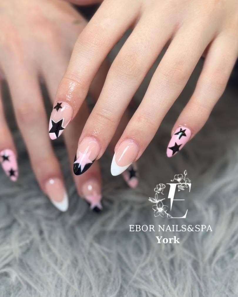 Almond French tips with black and pink star nail art